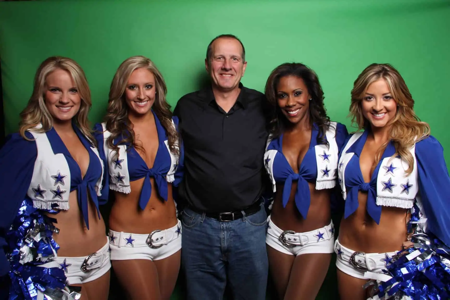 This corporate event was held at a hotel in Irving. The Dallas Cowboy Cheerleaders were hired to stand with guests at the green screen booth.